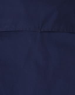 A navy blue closed front long-sleeve work shirt featuring a simple design and a logo.