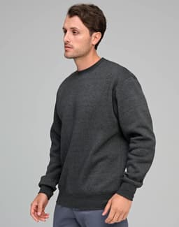 A man wearing a dark grey crew fleece sweatshirt, featuring a relaxed fit and ribbed cuffs.