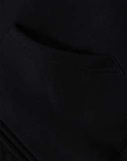 A close-up view of a black men's full-zip fleecy hoodie featuring a front pocket and a soft texture.