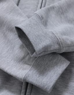 A grey men's full-zip fleecy hoodie with a close-up of the cuffs and fabric texture, featuring a logo.