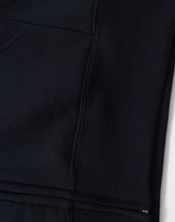 A black full-zip fleecy hoodie featuring a front pocket and a smooth texture. It has a logo on the fabric.