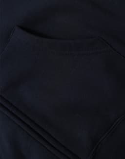 A close-up of a black men's full-zip fleecy hoodie featuring a front pocket. The fabric appears soft and textured.