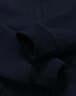 A navy blue kid's full-zip fleecy hoodie with a soft texture and cuffed sleeves. Features a logo.