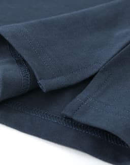 A navy cotton stretch polo shirt with detailed stitching and a subtle logo.