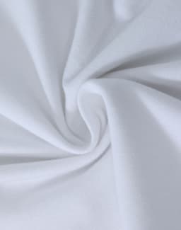 A close-up view of soft, white cotton fabric, showcasing a smooth and stretchy texture.