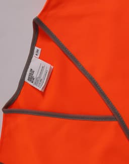 An orange safety vest with contrasting grey trim and an inner label, designed for children's safety wear.