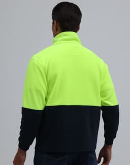 A full zip jacket featuring a high-visibility yellow upper and navy lower section, with a folded collar and branding.