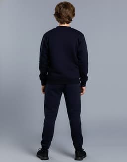 A navy fleecy sweater for kids, viewed from the back, paired with matching pants. The garment has a logo.
