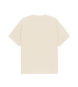A unisex oversized tee in a neutral cream colour with a plain back. It features a logo tag at the neckline.