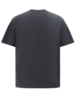 A heavy cotton oversized tee in dark grey, featuring a simple design and a relaxed fit. The garment has a logo.