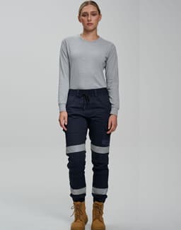 Cotton stretch drill cuffed work pants in navy blue with reflective tape, paired with a grey long-sleeve top.