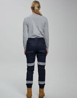 Cotton stretch drill cuffed work pants in navy, featuring reflective tape and a fitted design, viewed from the back.