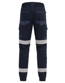 Cuffed work pants in navy with reflective tape and multiple pockets. Features an elastic waistband at the back.