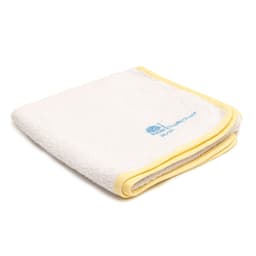 A folded white towel with a yellow border and a small logo in the corner.
