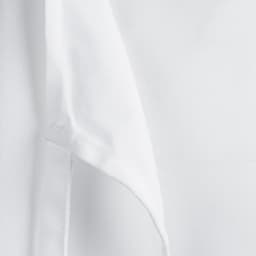 A white apron bib with a focus on the fabric texture and edge detail, featuring a logo on one side.