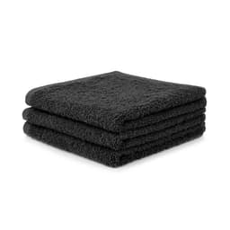 Three black face washers stacked neatly, showcasing a soft and fluffy texture. The product appears thick and absorbent.