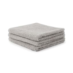 A set of three grey, plush face washers with a 500 gsm thickness stacked neatly. Each towel features a soft, textured finish.