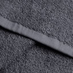 Dark grey large hand towels with a textured surface and a flat border. Features a logo or branding element.