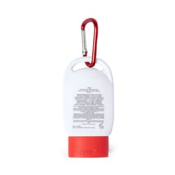 A white sunscreen bottle with a red cap, featuring a carabiner for attachment. The bottle has a logo on it.