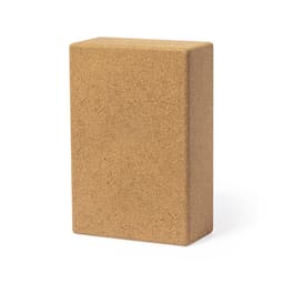 A cork yoga block in a rectangular shape, featuring a natural brown colour and a smooth finish.