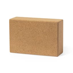 A rectangular cork yoga block in a natural brown colour. It features a smooth surface and has no visible branding.