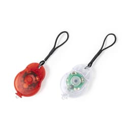 A set of two bike lights in red and clear plastic with a strap for attachment. Each light has a visible inner mechanism.
