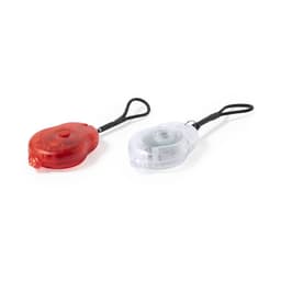 A red and a clear safety light, both with loops for attachment, designed for outdoor use.