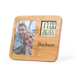 A wooden photo frame featuring a digital clock and thermometer display. Includes a logo at the bottom.