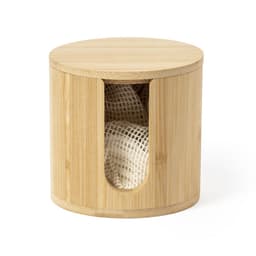 A bamboo storage container with a round lid and a cut-out for easy access to the contents inside.