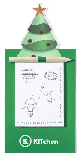 A green notepad with a Christmas tree design on top, featuring a pencil and a blank page with sketches.