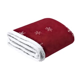 A plush red blanket with white snowflake patterns and a soft white fleece lining. It features a folded design.
