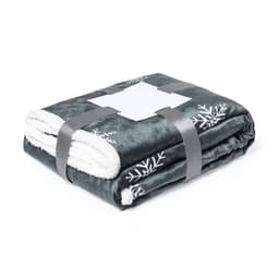 A folded grey and white Ricord Blanket with a decorative snowflake pattern, secured with a grey strap.