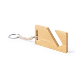 A bamboo keyring with a unique cut-out shape and a woven cord attached to a metal ring.
