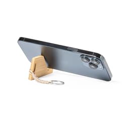 A sleek smartphone propped on a wooden stand, featuring a beige keyring attached. The phone has a shiny black back.