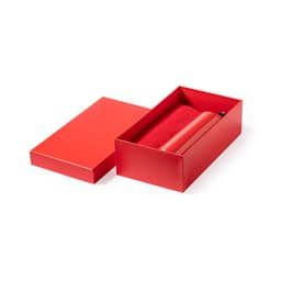 A red drink bottle and matching box, featuring a logo, resting on a white background.