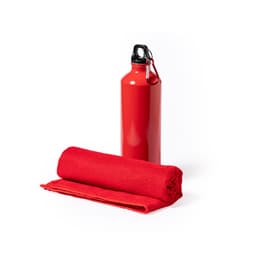 A red drink bottle with a black cap beside a rolled red towel. The bottle features a logo.