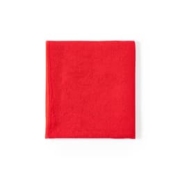 A red towel made from soft material, featuring a textured surface and a logo in one corner.