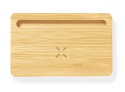 A bamboo charging organiser with a groove and a logo, designed for wireless charging devices.