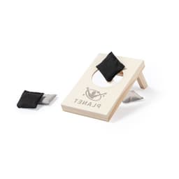 A wooden bean bag toss game in white and natural wood, featuring black and silver bags and a logo.