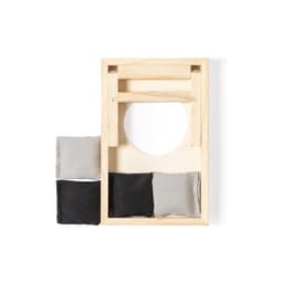 A wooden game board in natural tones with a circular opening, accompanied by four fabric bean bags in grey and black.