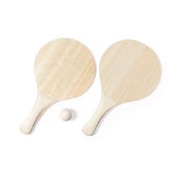 Two wooden beach rackets in natural colour with a small wooden ball in between them.