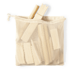 A cream mesh bag containing wooden game pieces, including sticks and blocks. The bag has a drawstring closure.