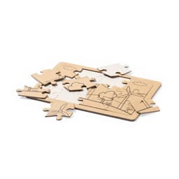 A wooden puzzle featuring an intricate design of clouds and wind turbines, with some pieces scattered around.