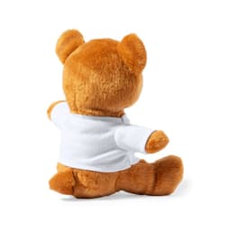 A plush teddy bear in brown, wearing a white shirt, seated with its back facing the viewer.