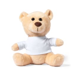 A soft, beige plush bear wearing a white shirt, featuring round eyes and a friendly expression.