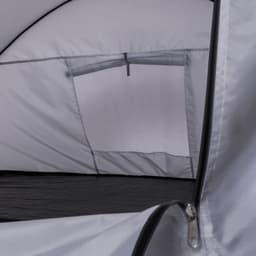 A grey tent interior featuring a mesh window and black flooring with a zippered entrance. It has a logo on the fabric.