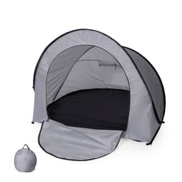 A grey tent with a black interior, featuring an entrance flap and a compact carry bag.