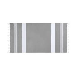 A grey bath towel with white stripes and tassels on the edges, featuring a branding logo.