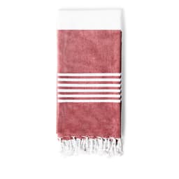 A folded bath towel in a terracotta colour with white stripes and fringed edges, featuring a logo.