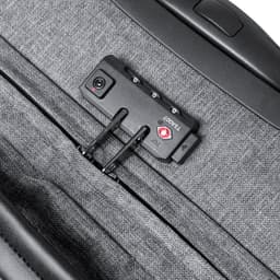 A grey wheeled bag featuring a zipped compartment and a locking mechanism with a small logo.